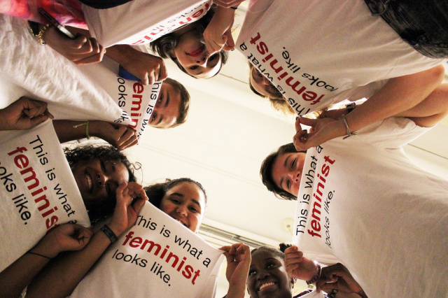 Group of people wearing shirt with this is what a feminist looks like logo