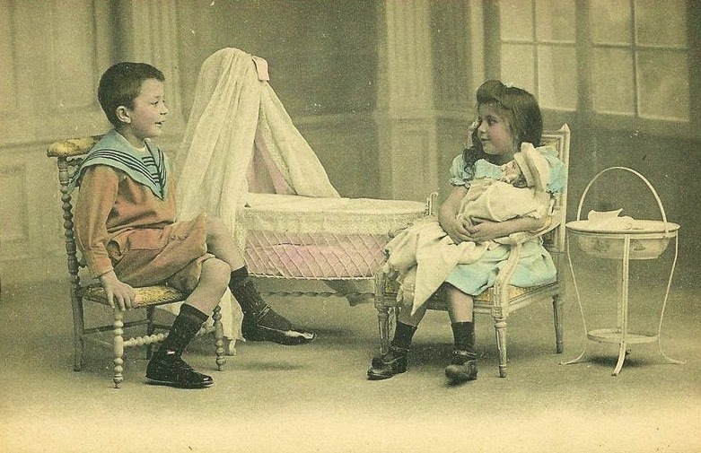 old photo of boy and girl playing house