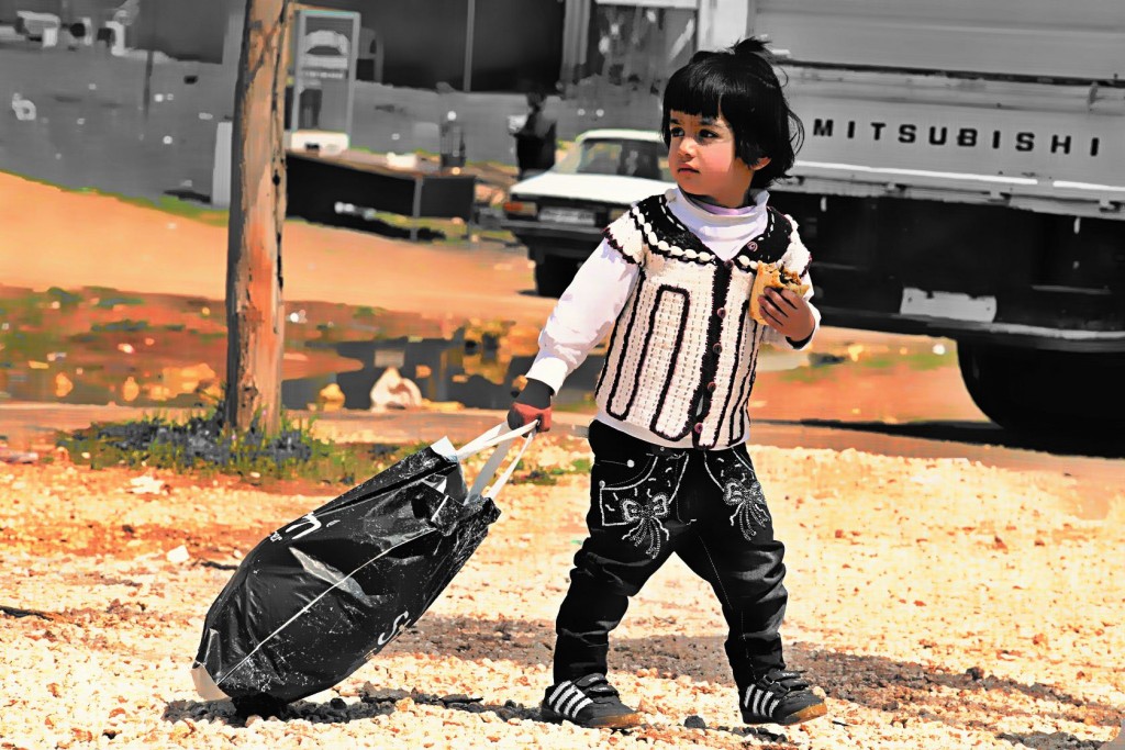 child returning into Kobane. 3.4.2015, Kobane, Syria