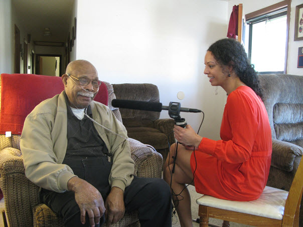 Dickerson speaking with veteran Charles William for her series on mustard gas testing during WWII