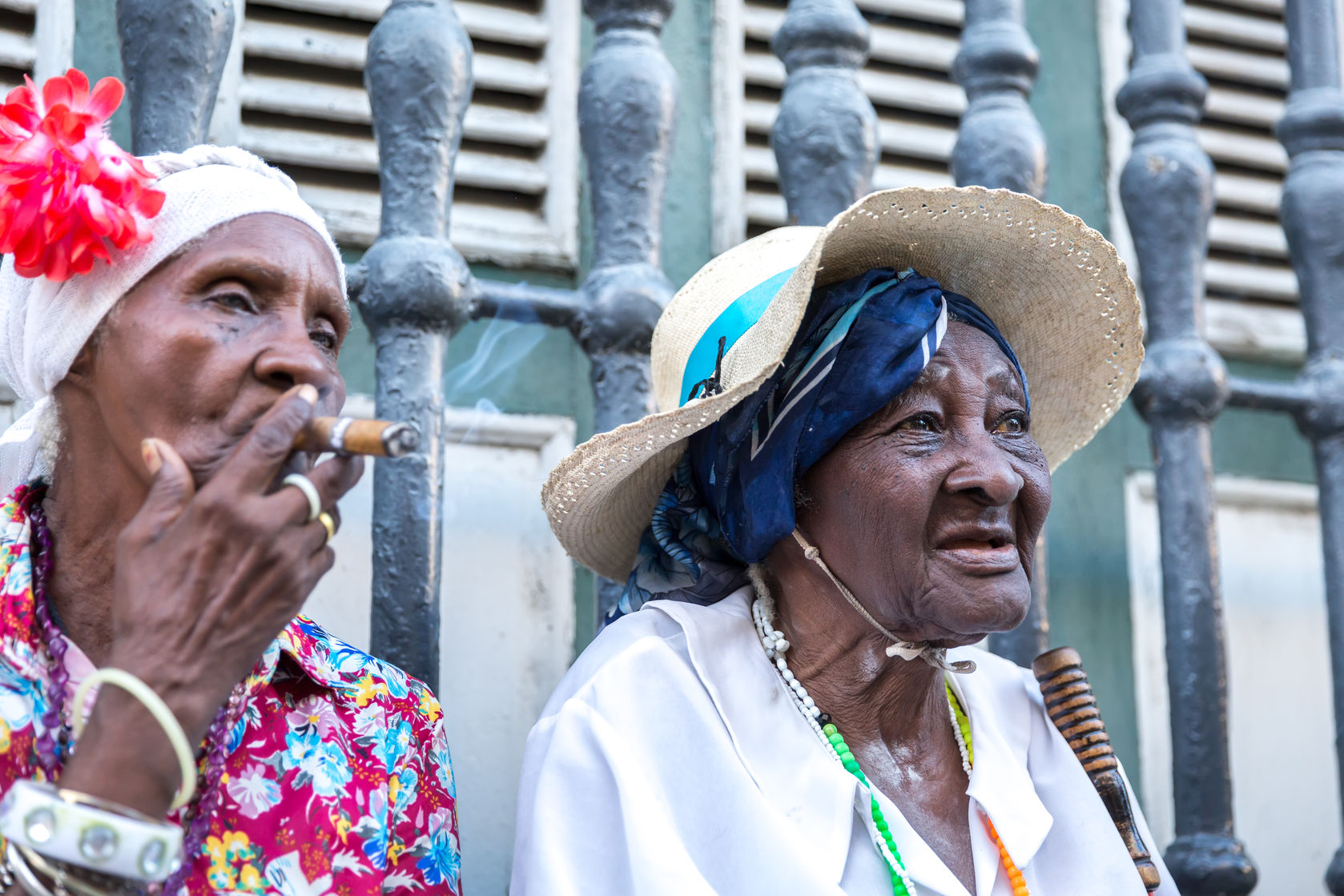 52445017 - portrait of african cuban woman smoking cigar in havana, cuba
